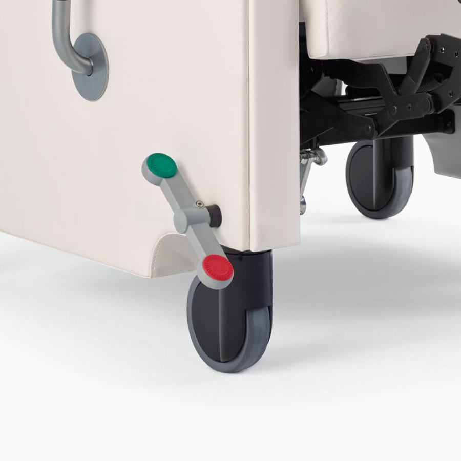 Close-up of the central brake and steer caster system on Nemschoff Pristo Recliner.