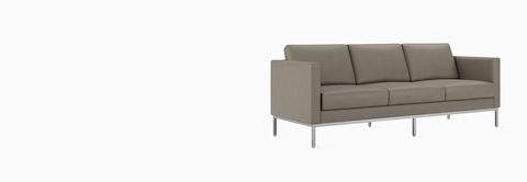 A Riva 3-seat sofa in a gray textile, viewed at an angle.
