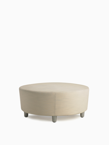 A Steps Lounge System Ottoman in a light-colored upholstery.