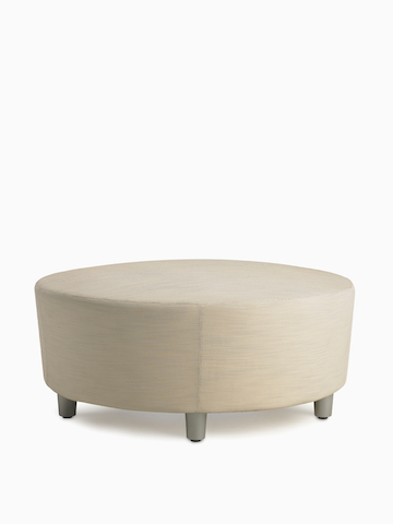 A Steps Lounge System Ottoman in a light-colored upholstery.