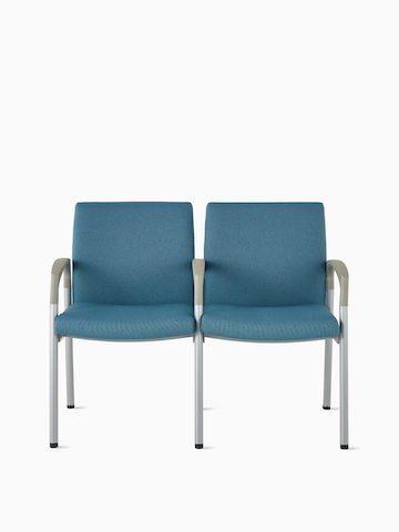 Front view of Valor two-seat multiple seating with intervening arms and legs in a blue upholstery, silver frame, and pewter armcaps on white sweep.