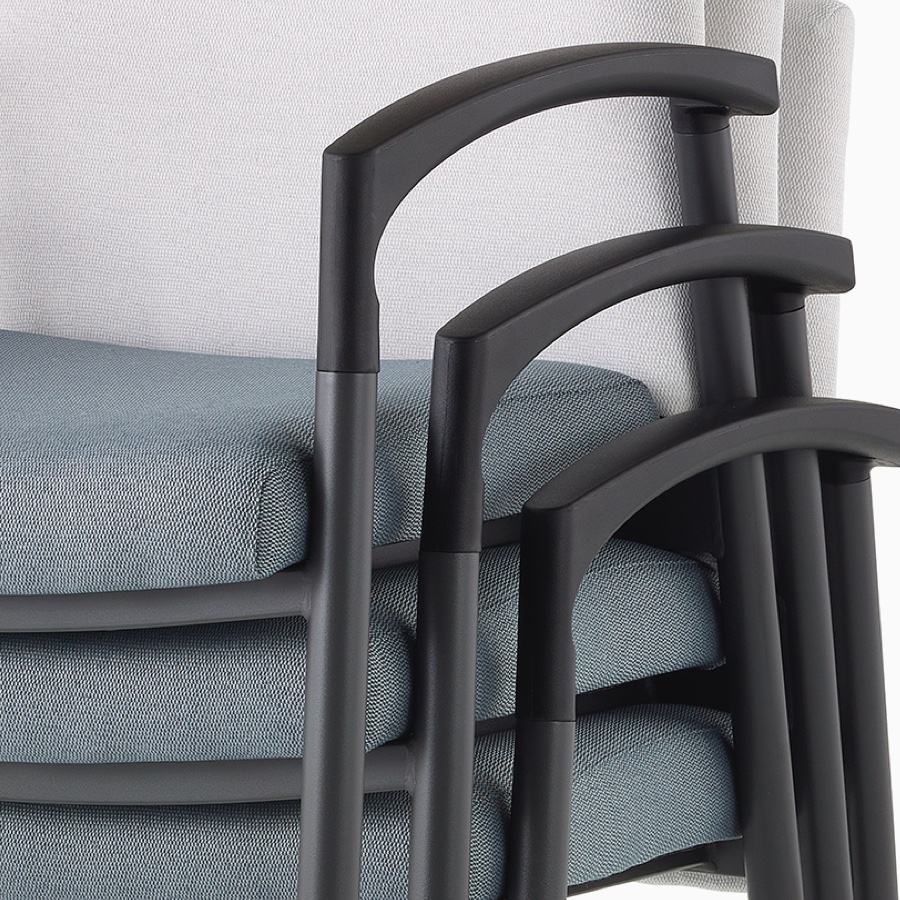 Detail of the Valor Stacking Chair with arms stacked three high.