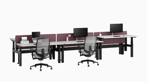 Nevi Link Sit-Stand bench with light gray work surfaces, maroon-colored fabric screens, CBS work tools, and Verus Chairs.