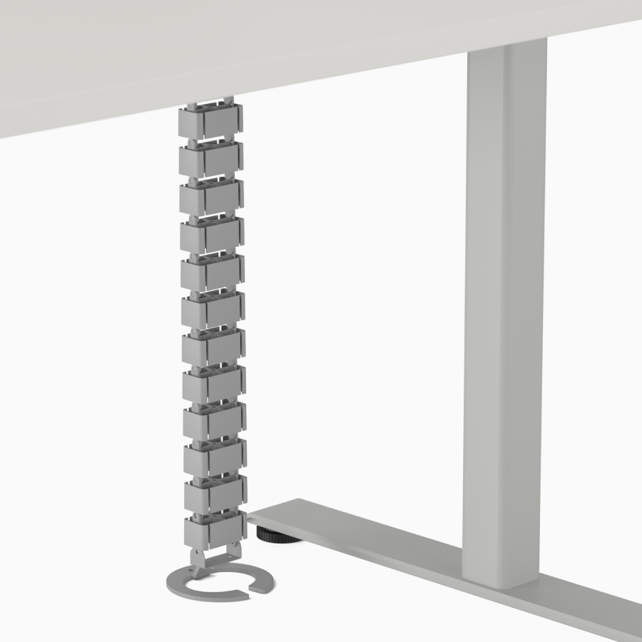 Freestanding umbilical cable manager detail on Nevi Sit-to-Stand Desk. 