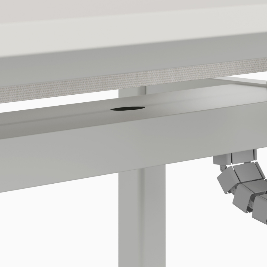 Vertical riser cable management detail on Nevi Sit-to-Stand Desk. 