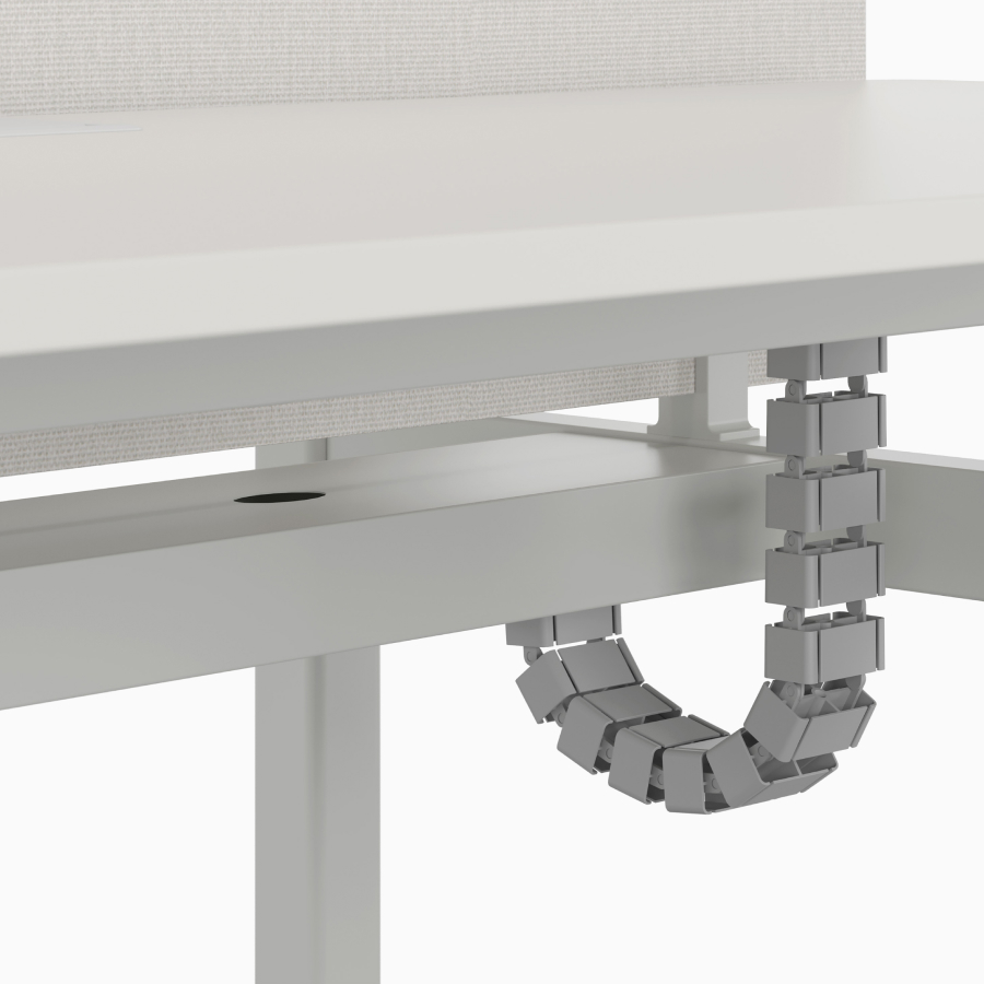 Vertical riser cable management detail on Nevi Sit-to-Stand Desk. 