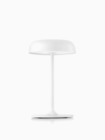 A white Ode table lamp. Select to go to the Ode Lamps product page.