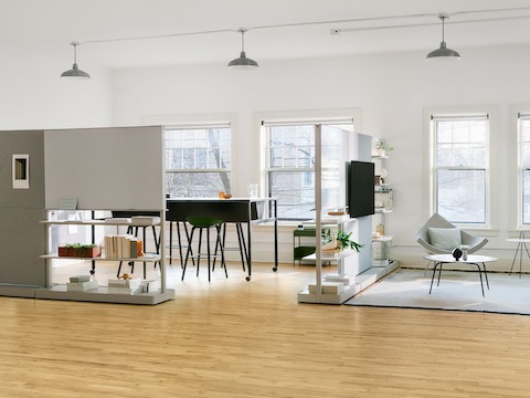 Grey OE1 Agile Walls with green Striad Sofa and checkerboard Nelson Coconut Chair in the foreground, with black OE1 Communal Table in the background.