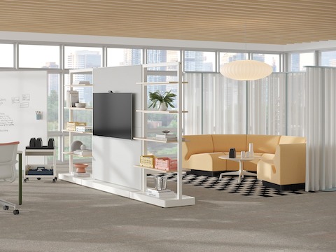 Open floor office with an OE1 Communal Table, OE1 Agile Walls, OE1 Mobile Easel, Chadwick Sofa and OE1 Freestanding Curtains.