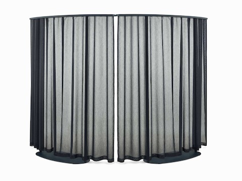 Two curved dark blue OE1 Freestanding Curtains with blue frames viewed from a front angle.