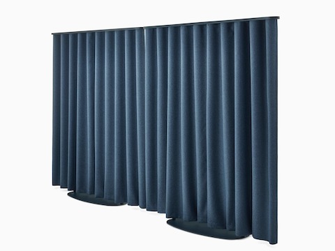Two blue OE1 Freestanding Curtains with blue frames viewed from a front angle.