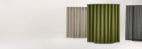 Three OE1 Freestanding Curtains with brown, green and black fabric, viewed from a front angle.
