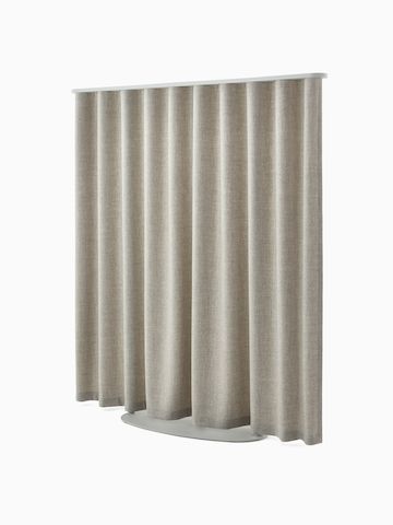 Light brown OE1 Freestanding Curtain with grey frame viewed from a front angle.