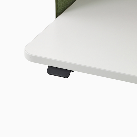 Close up image of a white OE1 Micro Pack surface with a black up/down switch, viewed from a front angle.
