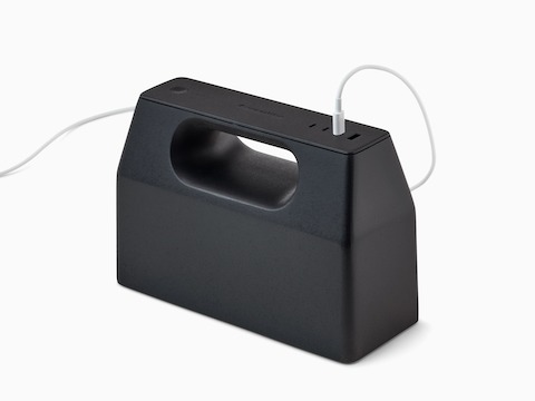 Black OE1 Power Pack with white USB-C cable plugged into it, viewed from an angle.