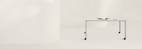 White and grey OE1 Project Table with casters, viewed from the front.