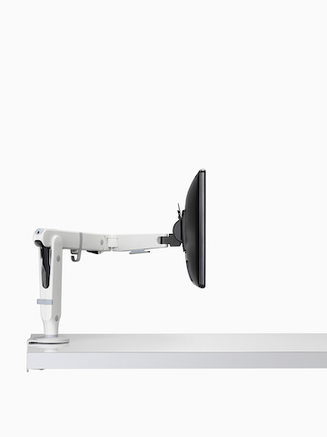 A white Ollin single-monitor arm, viewed from the side.