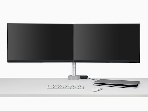 Front view of dual screens attached to a Wishbone Monitor Arm integrated with an Ondo Connectivity Module on a desk.