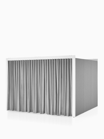 A three-sided Overlay space with tackable gray fabric on the exterior walls with a gray curtain pulled shut covering the opening. Select to go to the Overlay Product page.