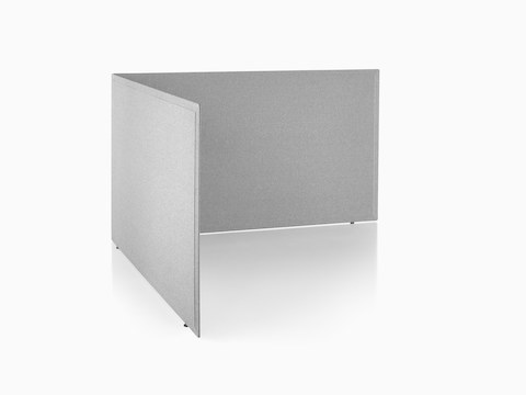 Viewed at an angle, two gray fabric Pari freestanding privacy screens connected in a L-shape configuration.