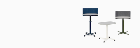 Three Passport Work Tables shown with various accessories in a variety of heights and finishes.
