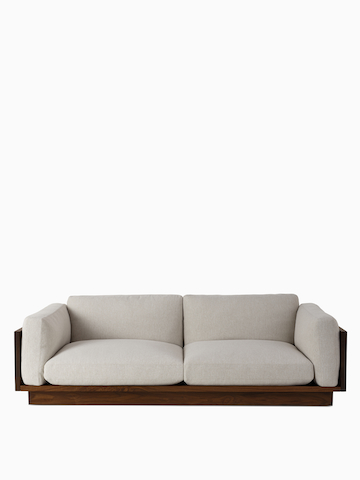 A front view of the Pawson Drift Sofa in walnut frame and grey cushions