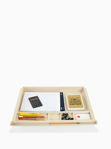A pencil drawer stocked with work supplies.