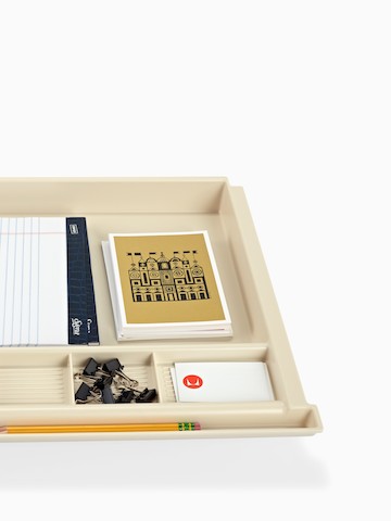 A pencil drawer stocked with work supplies. Select to go to the Pencil Drawer product page.