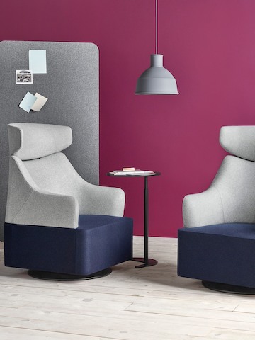 Two Plex club chairs with blue seats, gray backs, and gray headrests.