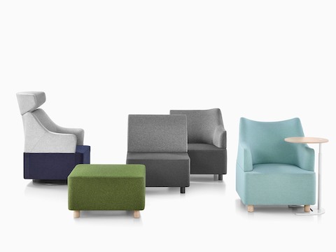 A collection of Plex seating elements, including gray modular components, blue club chairs, and a green ottoman.