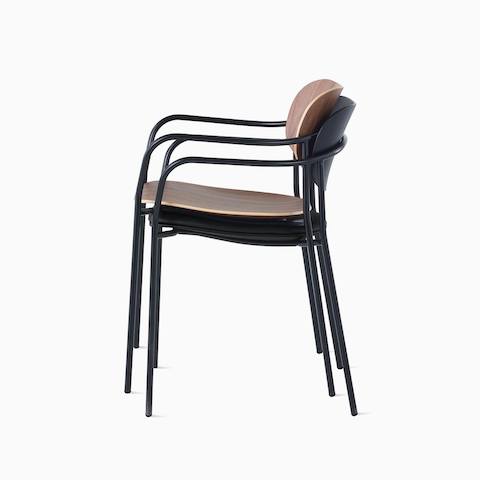 Portrait Chair with walnut seat and back stacked onto Portrait Chair with ebony ash back and upholstered seat.