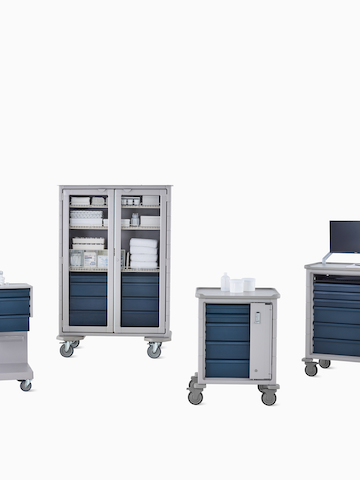 Group of Procedure and Supply Carts in light gray body with midnight blue drawers. Select to go to the Procedure and Supply Carts product page.