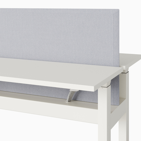 A close-up view of a Renew Link standing desk system's light gray trough-mounted screen.