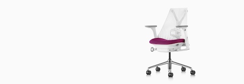 A white Sayl office chair with a magenta upholstered seat.