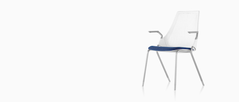 White Sayl Side Chair with a suspension back and blue upholstered seat, viewed from a 45-degree angle. 