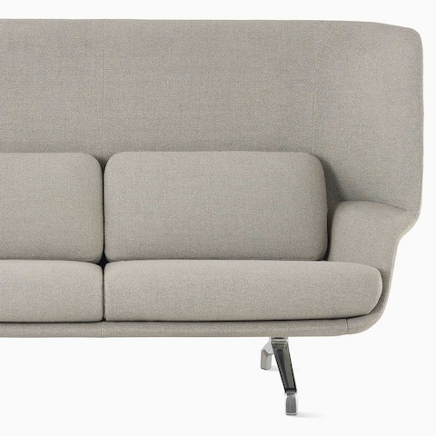 A high-back Striad Sofa in tan.