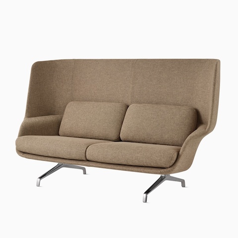 A high-back Striad Sofa in dark tan.