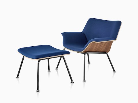 Swoop Plywood Lounge Chair and Ottoman with dark royal blue upholstery viewed from a 45-degree angle