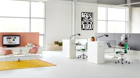 An environment showing Canvas Office Landscape with Tu Wood personal towers and some Setu chairs with a casual seating area off to the side.