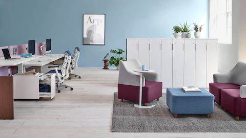 A row of vertical Tu storage units divide space in an open work environment.