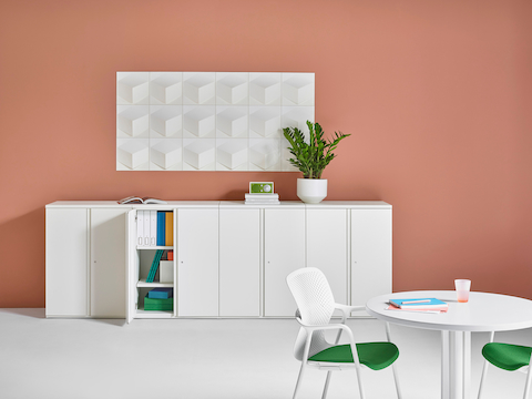 A row of vertical Tu storage units positioned against a wall. 