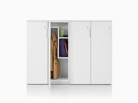 A set of Tu Wood lockers with a Z-interior and an open door showing a jacket and some personal items.