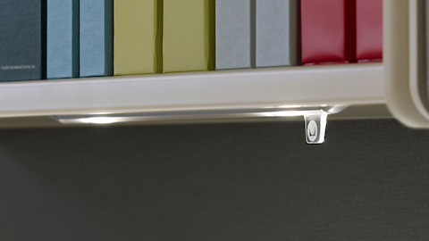 Close view of the illumination-control tab on a Twist LED Task Light.