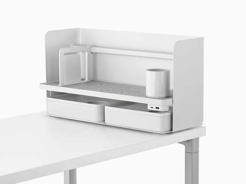 A small white Ubi Organizer with a bookend, pencil cup, USB power module, and two storage boxes.