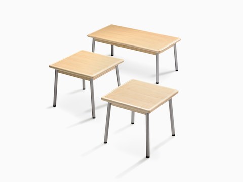 Overhead view of three Valor Tables, one rectangular and two square, each with steel legs and a light wood finish.