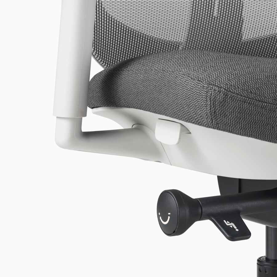 A close-up view of a Verus Chair's black adjustment knob.
