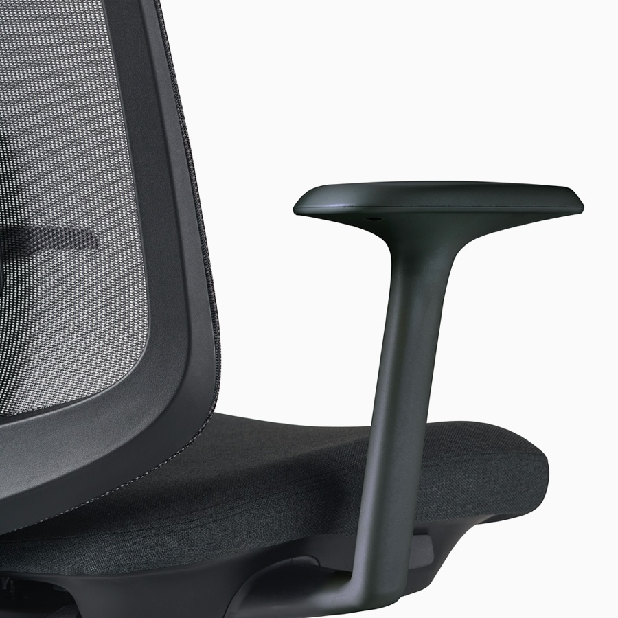 A close-up view of a Verus Chair's black fixed arm.