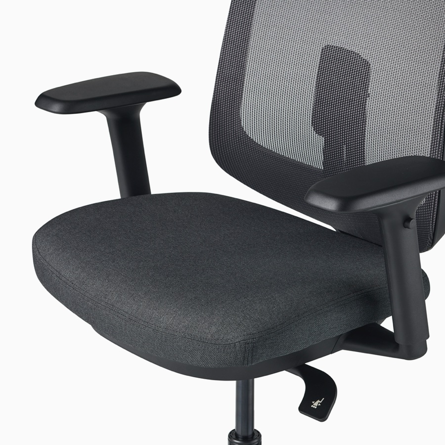 A close-up view of a Verus Stool's black upholstered seat.