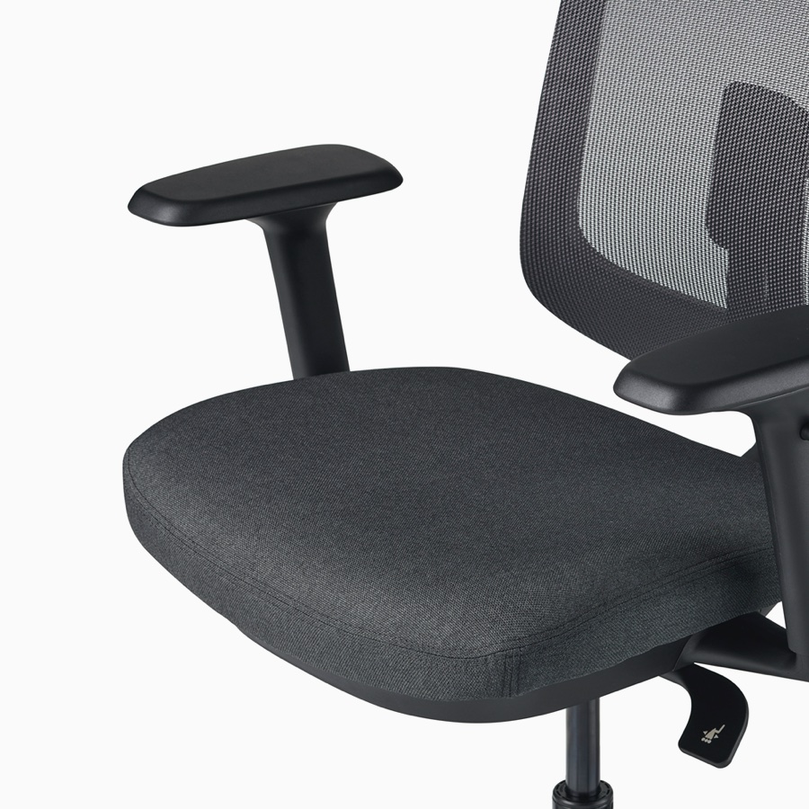 A close-up view of a Verus Chair's black upholstered seat.