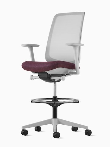 Angled view of a gray Verus Stool upholstered in purple with suspension back.